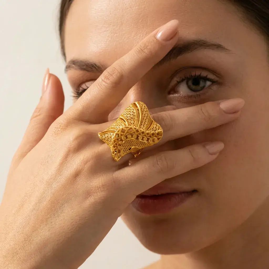 A model wearing the Khaleeji Filigree Ring in 21K yellow gold